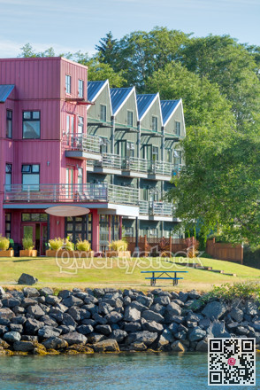 Waterfront walkway and recreation area in front of residential building