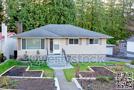 Residential family house with wooden garden beds on the front yard