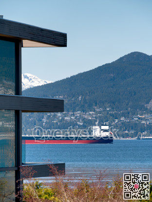 Ocean-going cargo vessel in Coal harbor bay in Vancouver