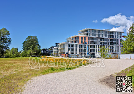 Z shaped pathway in front of new residetial buildings under construction
