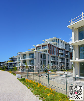 Gravel pathway along the new residential buildings under construction