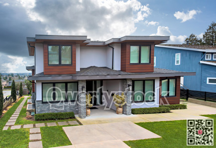 Big luxury residential house on cloudy sky background