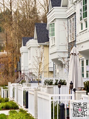 Frontside of brand new residential townhouses. Row of townhouses for sale