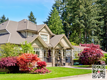 A perfect neighborhood. Luxury residential house with green lawn in front