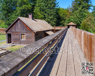 An old wooden fortress with a residential house in the inner yard