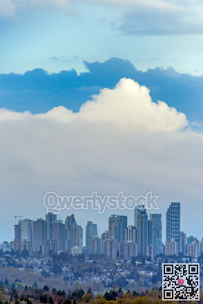 Overview of Metrotown cityscape on cloudy sky background