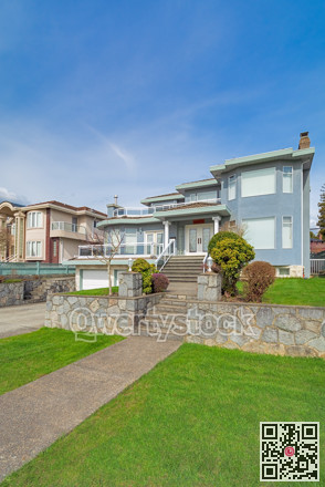 Luxury residential houses with landscaped front yard on land terrace