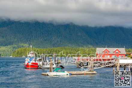 Motor boats are mooring to the piers on Pacific ocean bay in Tofino