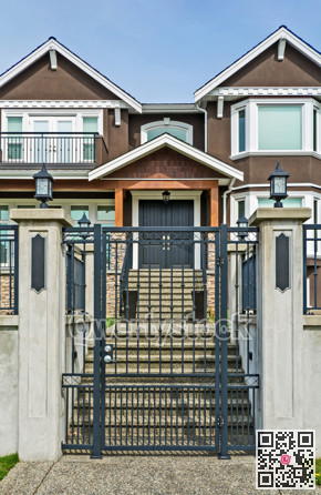Luxury residential houses with metal gate at the front