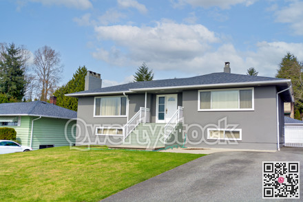 Average residential house with landscaped front yard in Canada