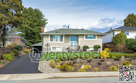 Average residential house with landscaped front yard in Canada