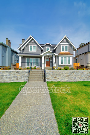 Luxury residential houses with landscaped front yard on land terrace