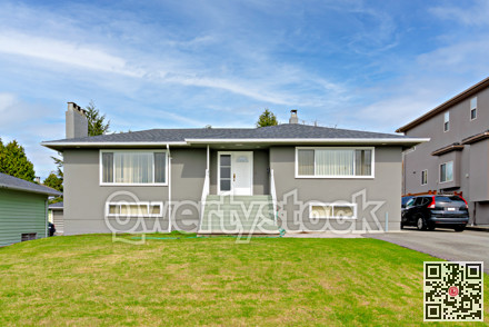 Average residential house with landscaped front yard in Canada