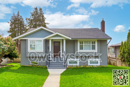 Average residential house in Canada on cloudy sky background