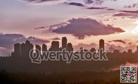 Urban cityscape silhouette on sunset sky background
