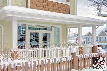 Front yard and patio of family house on a bright winter day