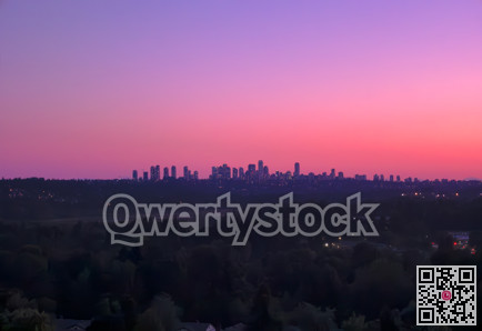 Urban cityscape on lilac sunset sky background