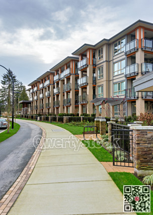 Residential apartment building with walking pathway in front