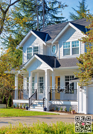 Detached residential house on bright sunny autumn day