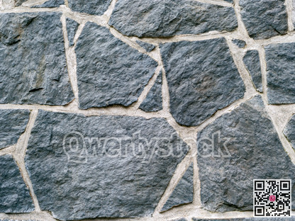 Dark grey rocks texture background. Black rock wall texture
