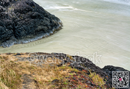 Rocks and sand on Pacific ocean beach near Tofino, British Columbia, Canada