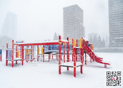 Children's play ground in snow on winter season in Canada
