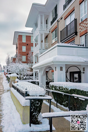 Low-rise residential building with easy access at the entrance on winter season
