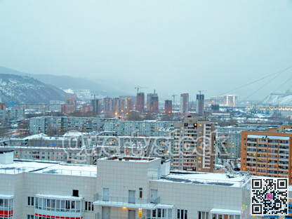 Cityscape on foggy winter evening. Residential district on winter season