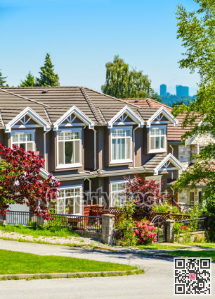 A row of townhouses on street in suburban of New Westminster, British Columbia.