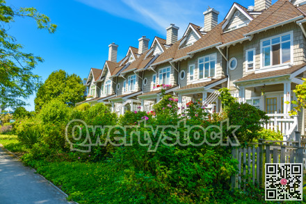 Residential townhouses on sunny day in Vancouver, British Columbia, Canada.