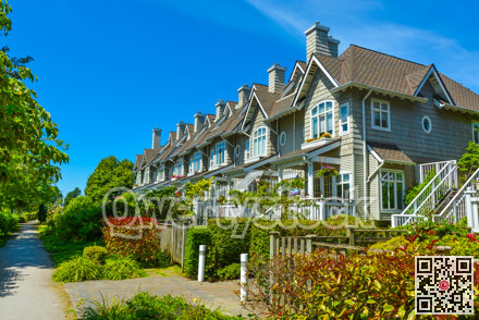 Residential townhouses on sunny day in Vancouver, British Columbia, Canada.