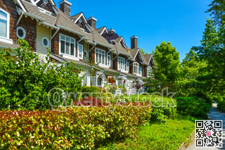 Residential townhouses on sunny day in Vancouver, British Columbia, Canada.