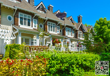 Residential townhouses on sunny day in Vancouver, British Columbia, Canada.