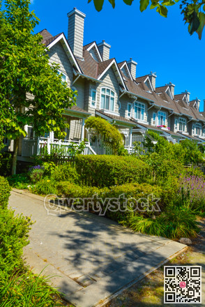 Residential townhouses on sunny day in Vancouver, British Columbia, Canada.