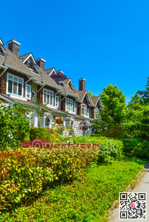 Residential townhouses on sunny day in Vancouver, British Columbia, Canada.