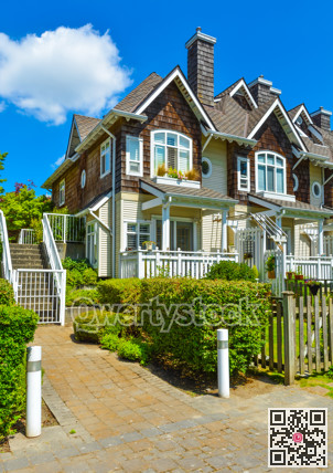 Residential townhouses on sunny day in Vancouver, British Columbia, Canada.