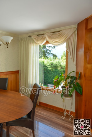Interior of luxury residential house with look at back yard through the window