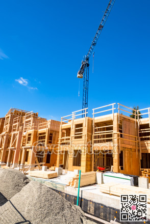 New residential building under construction with the crane above