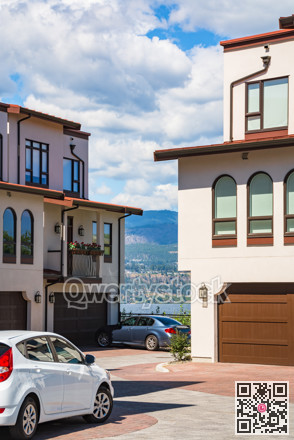 Residential townhouses with scenery view on a lake and mountains