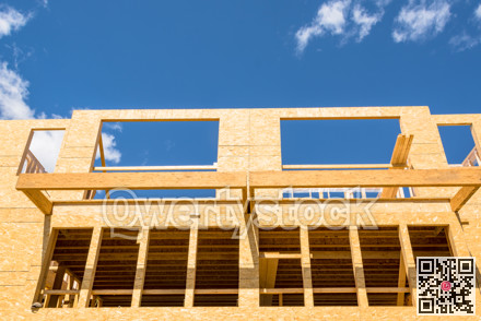 New residential building under construction on blue sky background