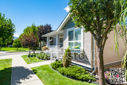 Entrance of residential house with concrete pathway in front of the house