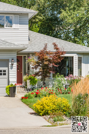 Front yard and main entrance of family house on sunny day in British Columbia
