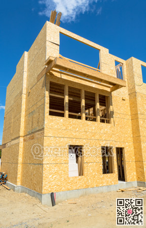 Low rise wooden framework of the building on concrete base