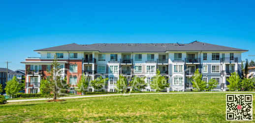 Brand new apartment building on sunny day in British Columbia, Canada.