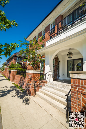 Main entrance of brand new apartment building on sunny day