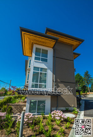 Brand new townhouse complex on sunny day in British Columbia.