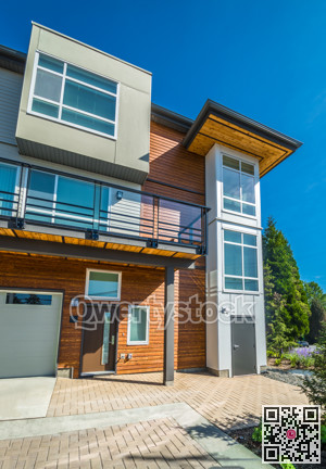 Brand new townhouse building on sunny day in British Columbia.