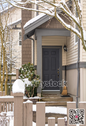 Entrance door of residential townhouse on winter time.