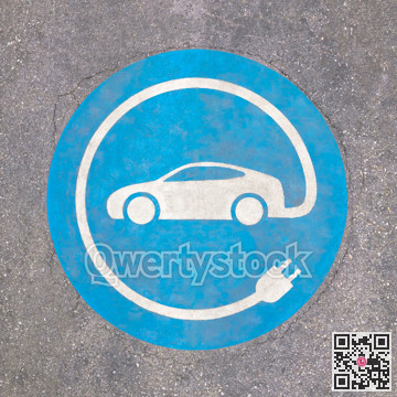 EV - charging station sign on asphalt. 'E' sign on asphalt texture.