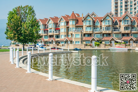 Luxury residential building with boat pier at the entrance in British Columbia